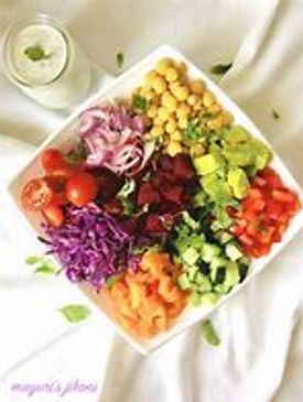 Colorful mixed salad with chickpeas and fresh vegetables.
