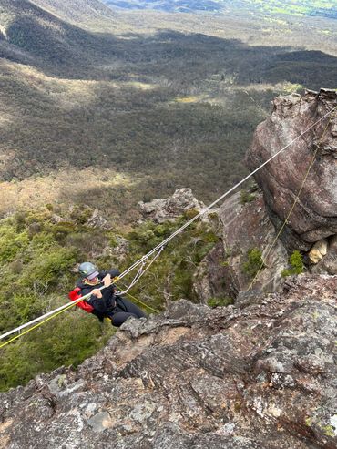 Tyrolean traverse (with a participant climbing horizontally across a gap