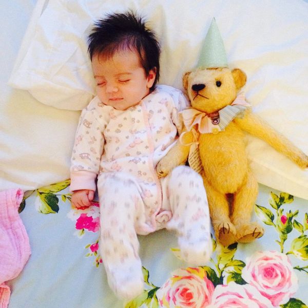 Baby sleeping with teddy bear