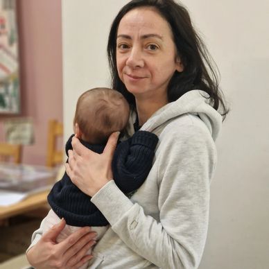 Lady holding a newborn baby