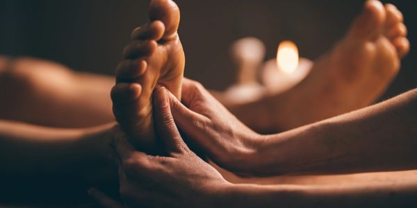 a man receiving a foot massage