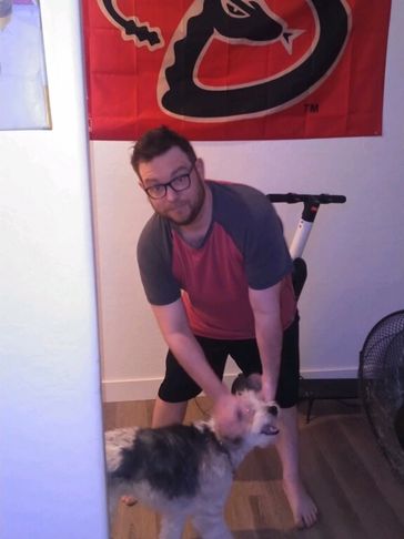 Chris petting his dog
