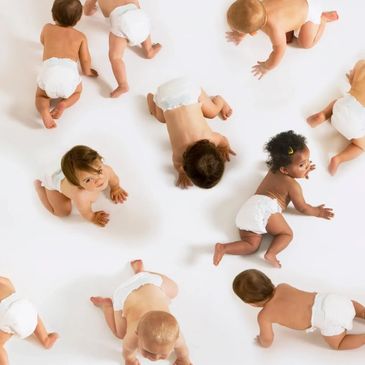 Babies in diapers crawling around.