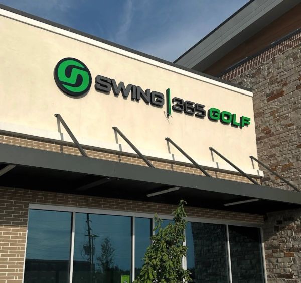 Exterior of Swing 365 Golf store with signage.