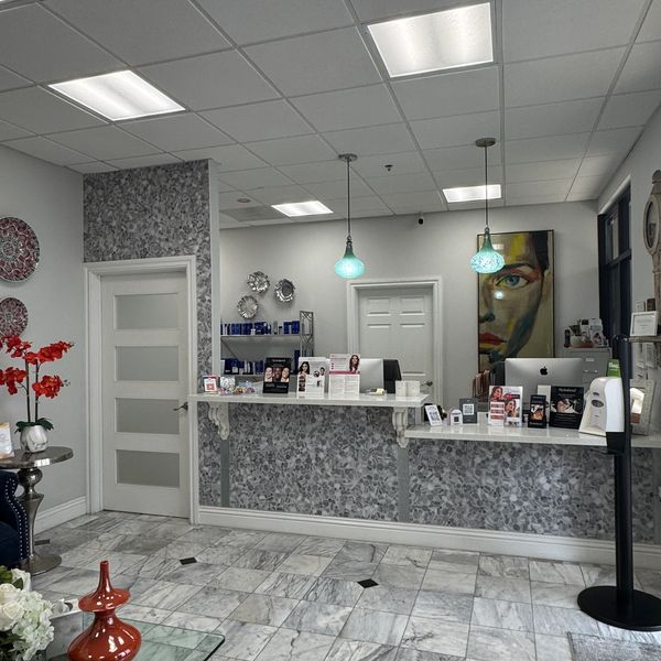 Reception area with marble flooring and modern decor.