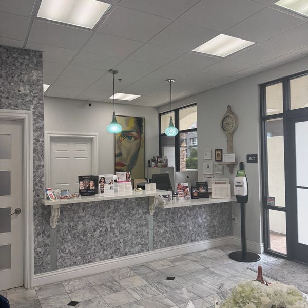 Reception area with sleek counters and artistic décor.