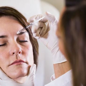 Woman receiving a facial injection.