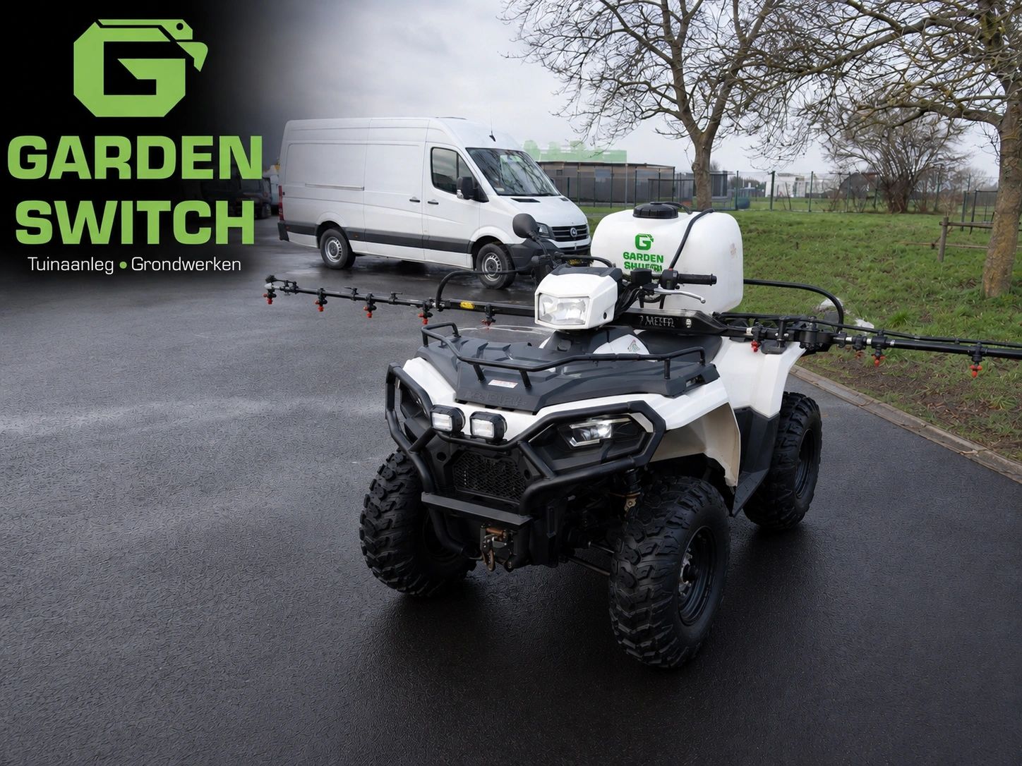 All-terrain vehicle with sprayer tank for garden work, parked near a white van.