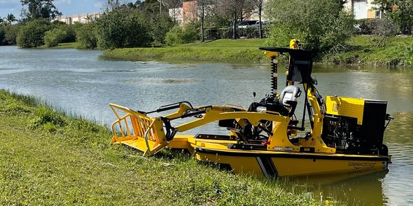 mechanical weed removal , removes aquatic plants without herbicides or chemicals. weedoo boat