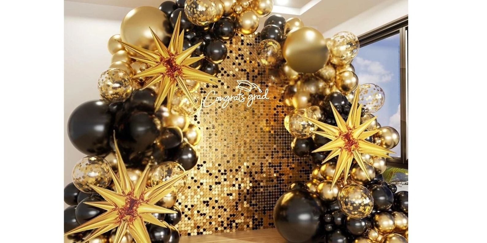 black and gold balloons, graduation backdrop with congrats grad led light on a gold shimmer w