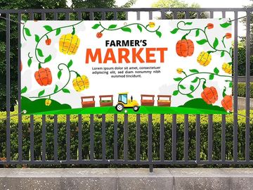 Colorful farmer's market banner with pumpkins and a tractor.