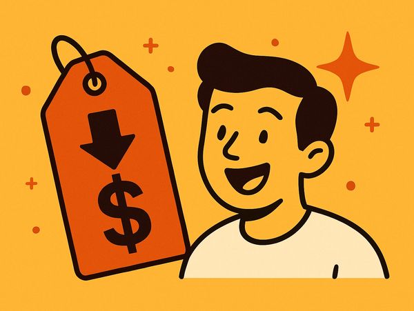 Happy man with a price tag showing a dollar sign and downward arrow.