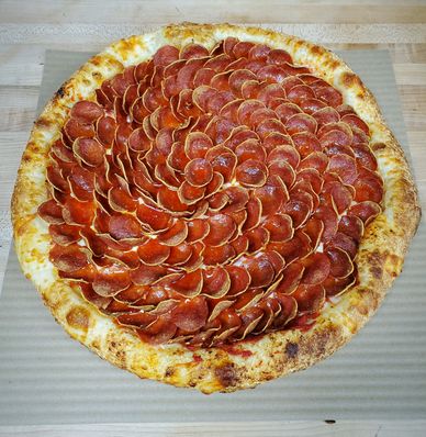 Dragonscale pizza, uncut, fresh from the oven — the photo that received 32,000 upvotes on Reddit