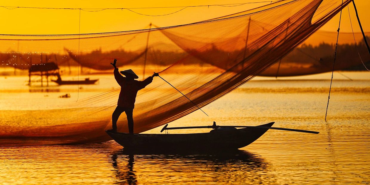 fisherman at sunrise in Hoi An, Central Vietnam Photo Tour