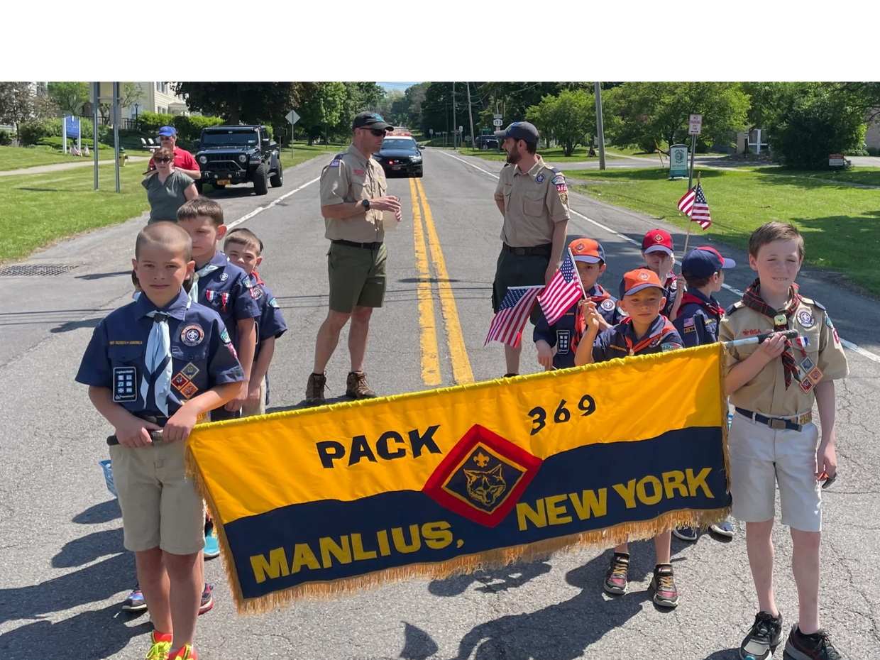 Pack 369 marching in the 2022 Memorial Day Parade in the Village of Manlius