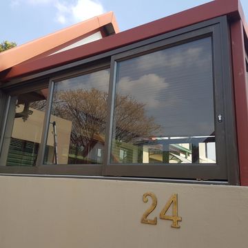 Bronze Aluminium triple sliding window