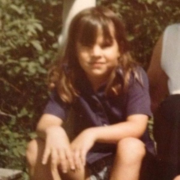 Lori in her childhood at the lake cabin