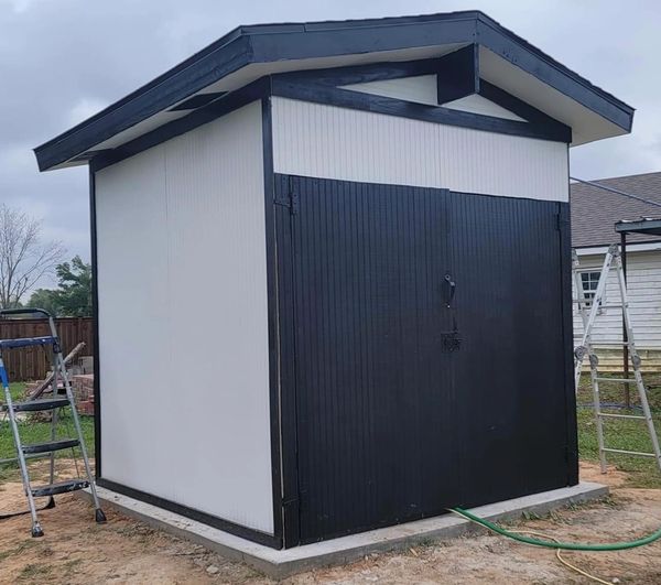Wooden pump house on cement slab in Lake Charles