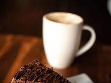 Coffee break with coffee and cake. Chocolate cake. Chocolate quinoa cake. Fresh roasted coffee. Orga