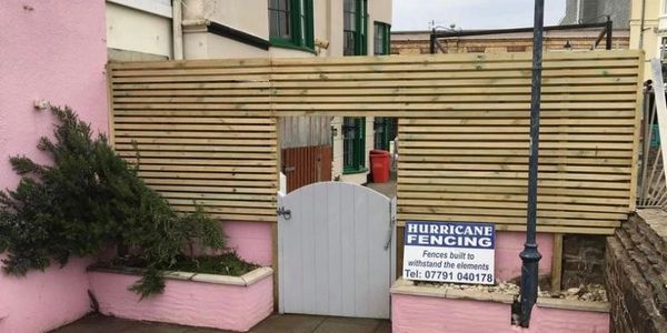Ilfracombe harbour new wooden residential fence.
