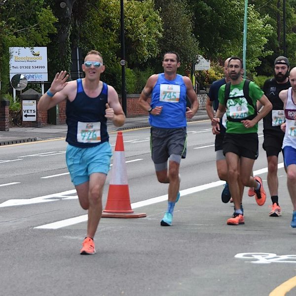 Group of runners competing in a road race.