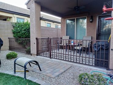 Ornamental iron patio fence and matching gate, rust brown powder coat. Goodyear, Arizona
