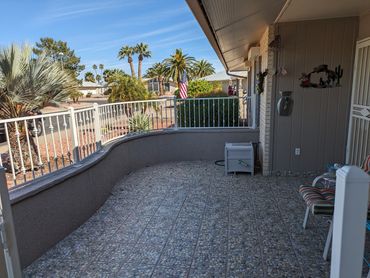 Curved wrought iron courtyard fence with white powder-coated finish. Sun City, Arizona