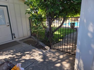 Residential pool fence with matching gate, black powder coat finish, Paradise Valley, Arizona.