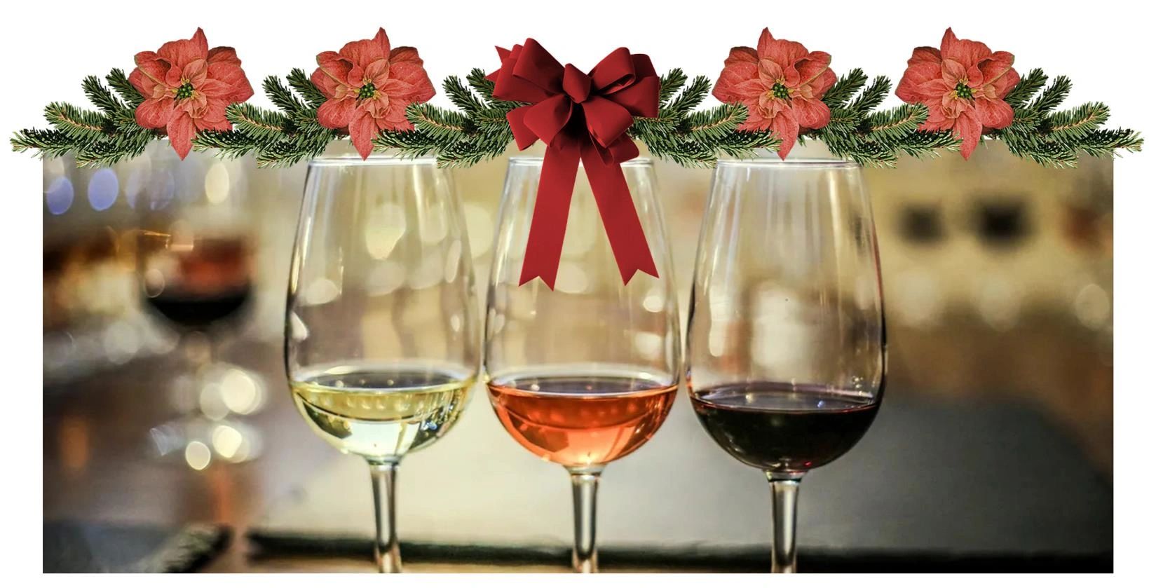 Three wine glasses with festive holiday decorations.