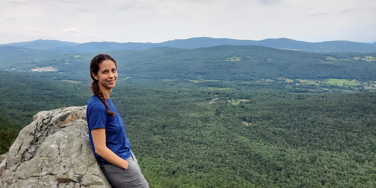 Amanda Kenyon hiking at a mountain view in Vermont