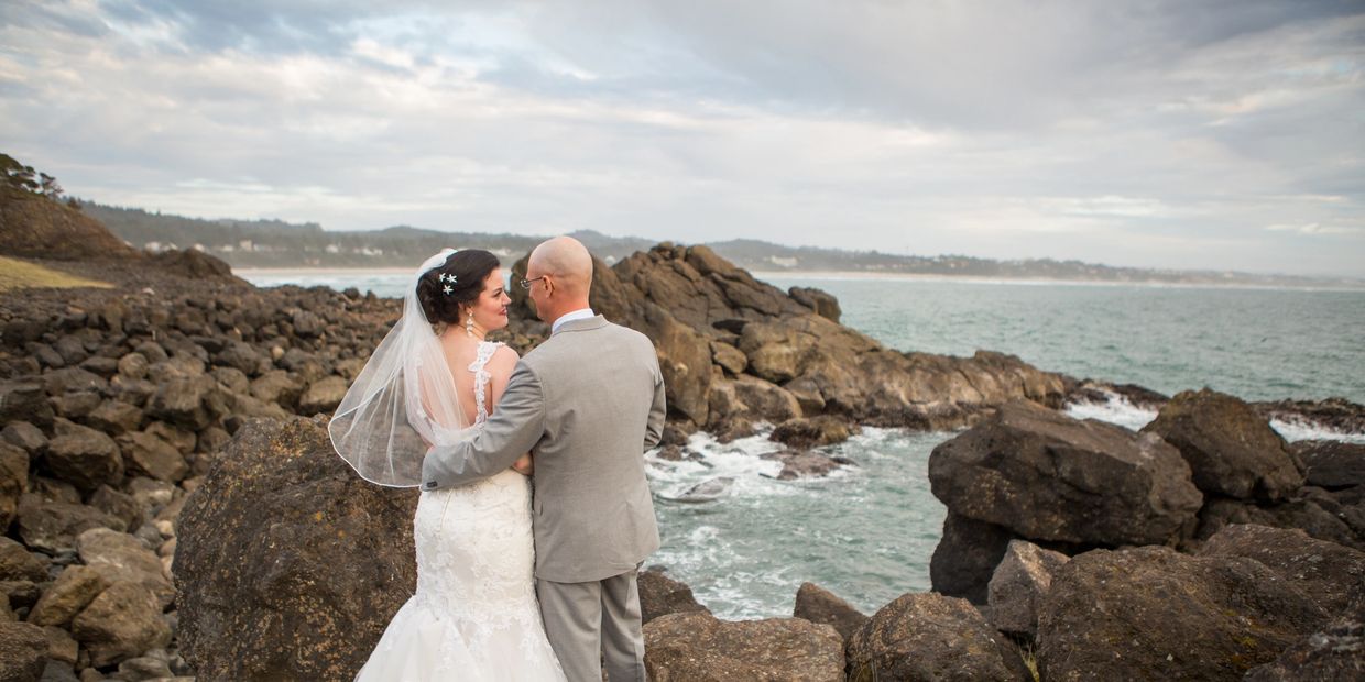 Wedding couple on rocks by ocean, Blending Hearts, elopement, Oregon, coast, beach, Tekoa Rose Photo