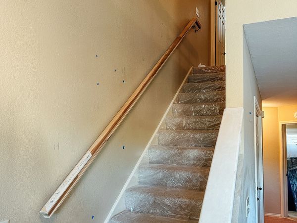 drywall repaint and stair handle install