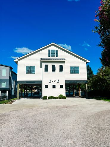 Custom black metal awnings on Texas coastal home. 24-gauge Galvalume® steel with Kynar® finish.