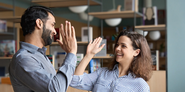 Team members highfiving