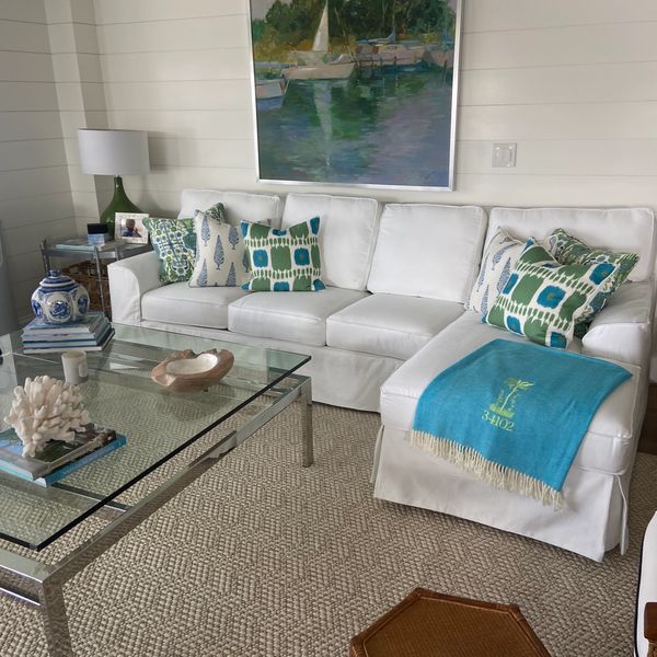 White sectional slipcover with decorative pillows