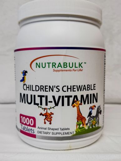 Bottle of children's chewable multi-vitamin tablets with animal shapes.