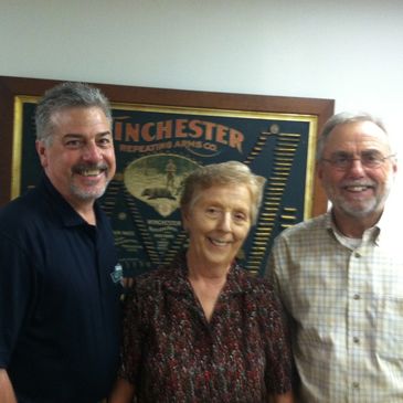 Wes Dillon (Left) and Family evaluate sale of WINCHESTER 1897 DOUBLE-W Cartridge Board at auction