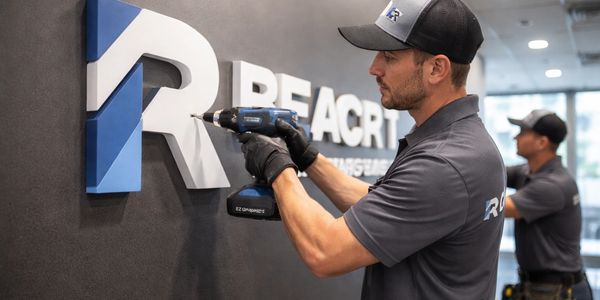 Mounting 3D signage in lobby