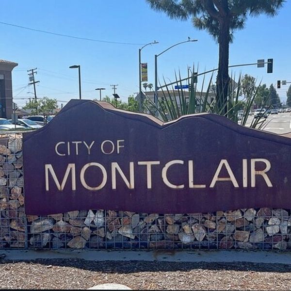 Welcome sign for the City of Montclair on a sunny day.