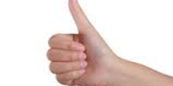 Hand showing thumbs-up gesture.