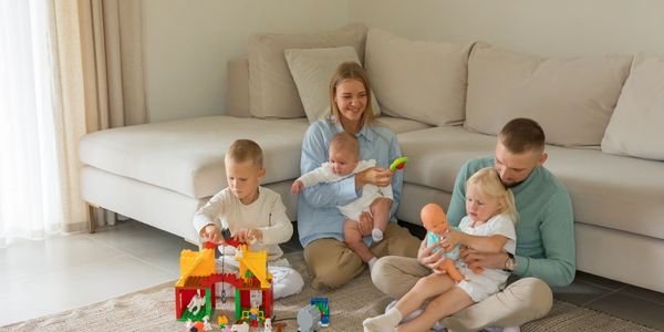 Family playing with toys in the living room.