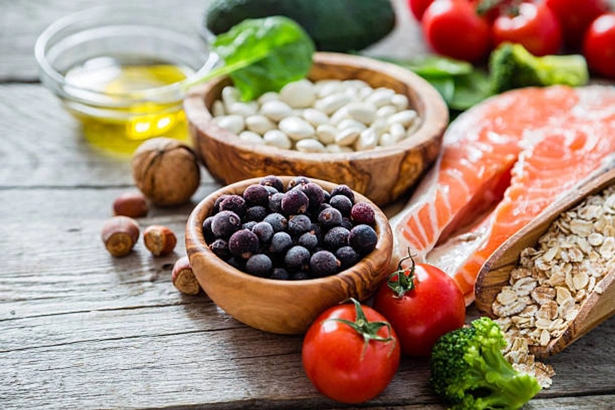 Various nutritious food items are lying on table.