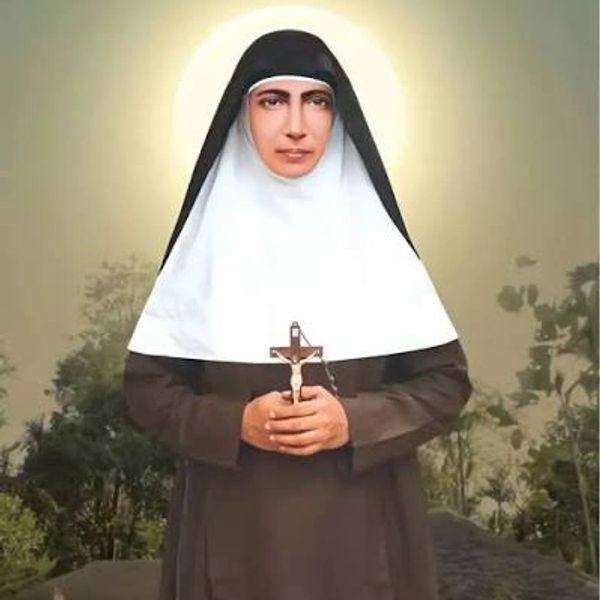 Portrait of a nun holding a crucifix.