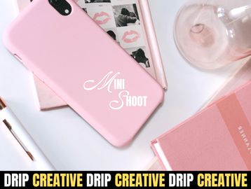 Pink phone case and creative workspace.