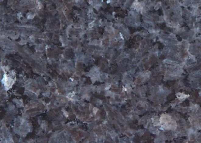 Close-up of a dark granite surface.