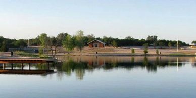 Image of the swimming dock, lake, and shoreline at Wheeler Branch Park