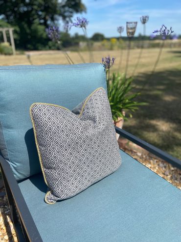 Teal green outdoor box cushion with Moroccan boho style outdoor scatter cushion 