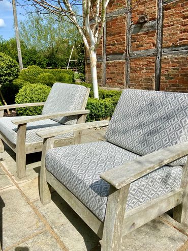 Outdoor patterned grey and white box cushions