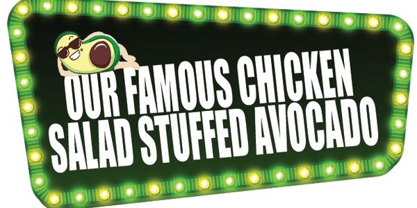 Bright sign advertising famous chicken salad stuffed avocado with a cool avocado mascot.