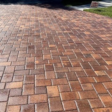Sealed paver driveway in Rockledge, FL with enhanced color and protection